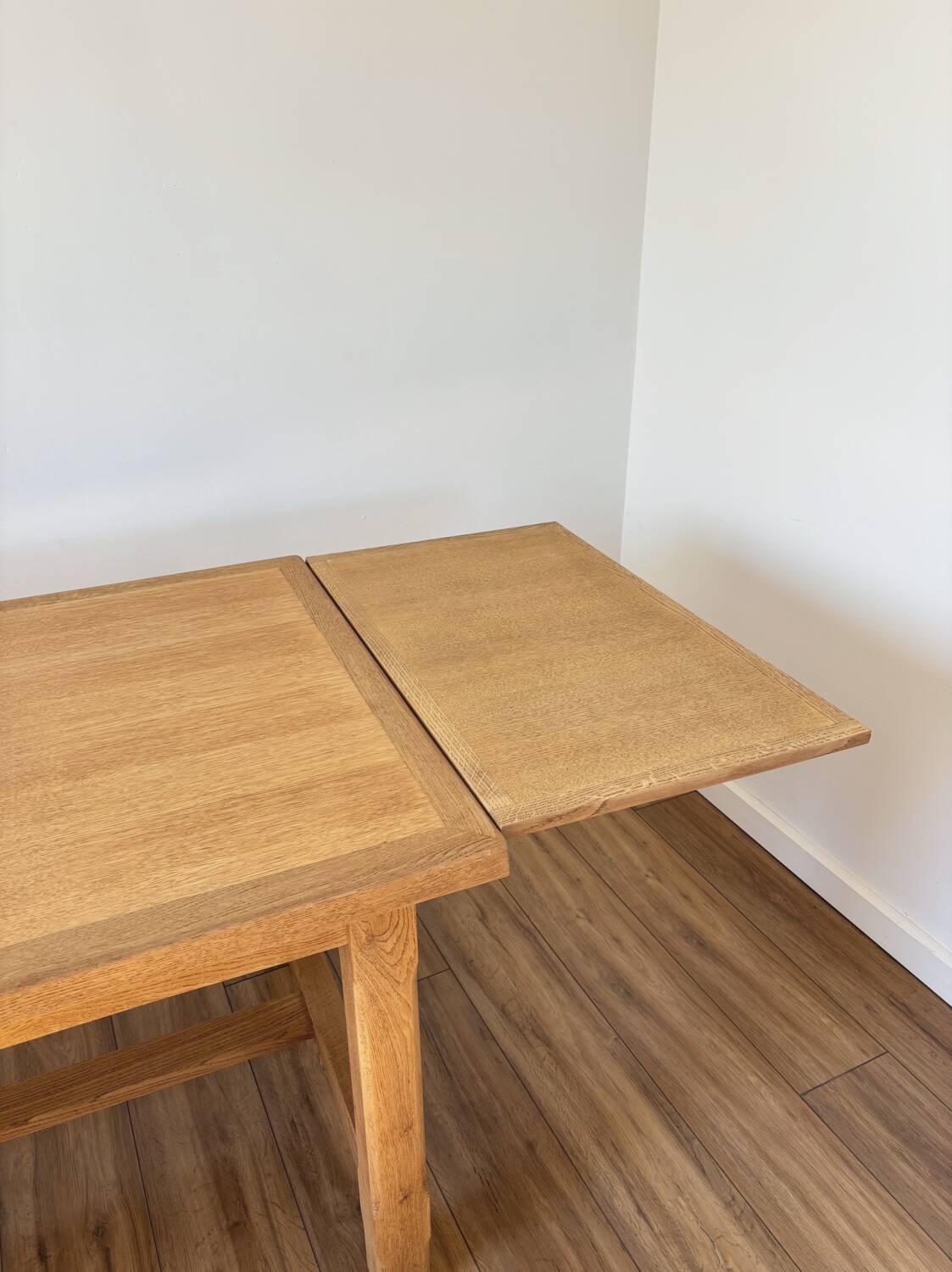 Solid oak farmhouse table with extensions.