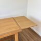 Solid oak farmhouse table with extensions.