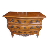 Solid wood commode in an antique style.