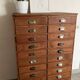Old apothecary trade furniture in vintage wood 24 drawers.