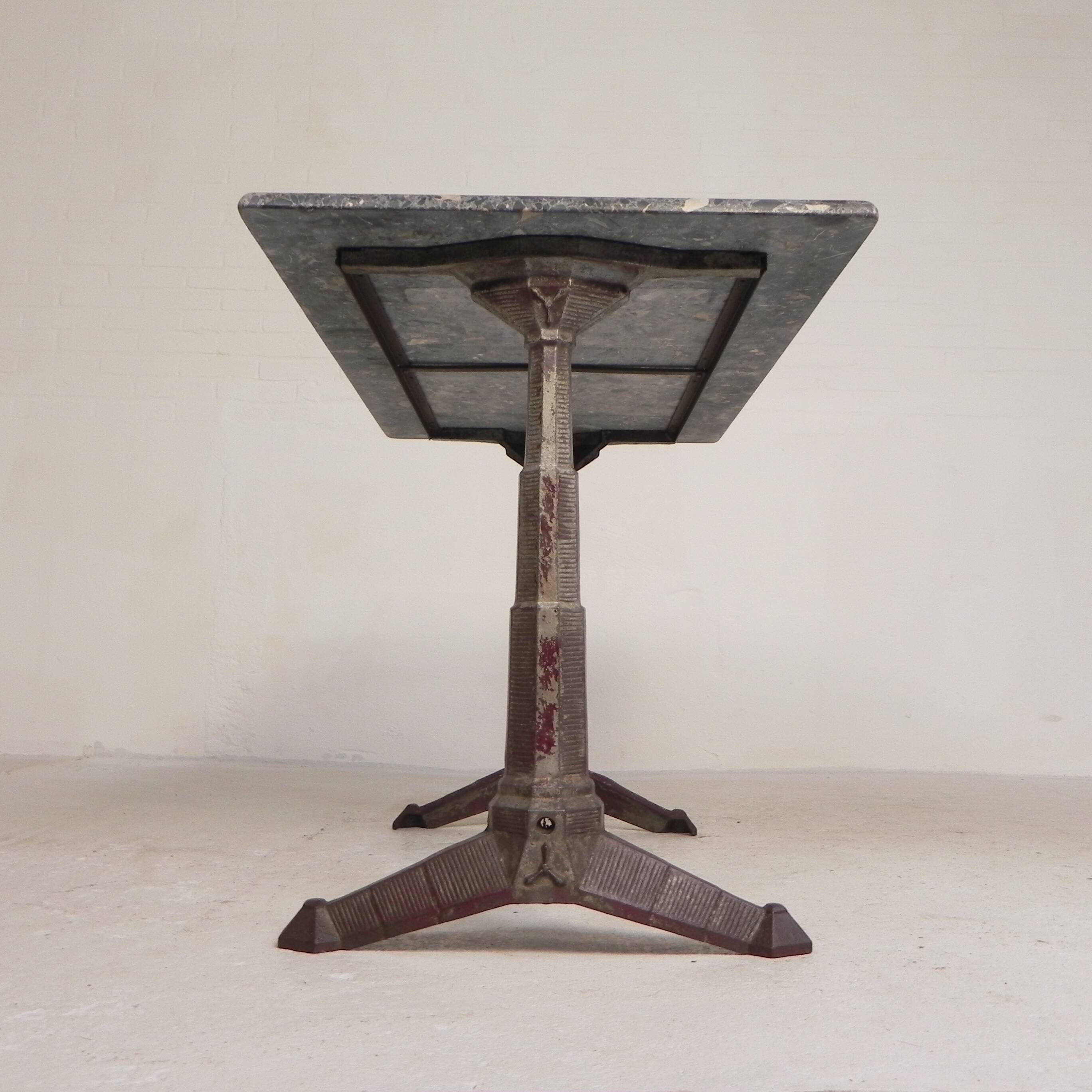 Bistro table with a marble top on a cast iron frame, 1930s.