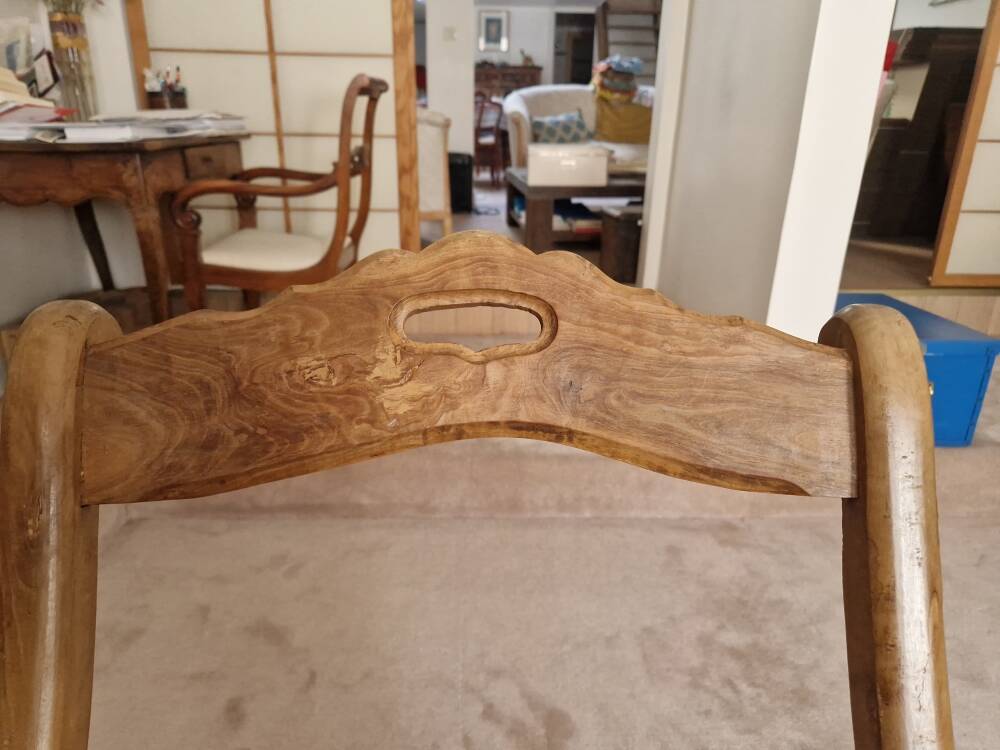 Oak rocking chair with a straw seat.