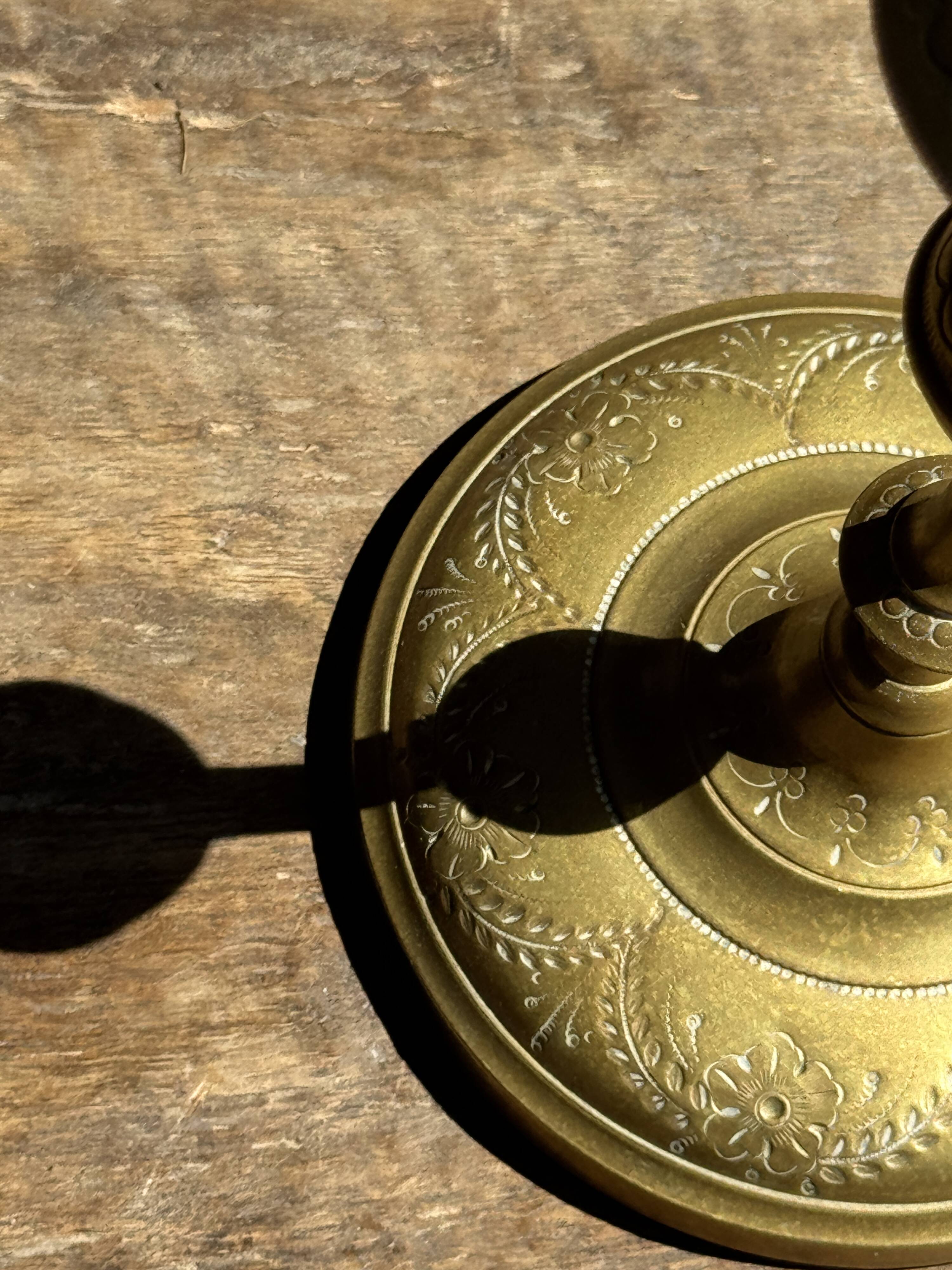 Pair of gilded candlesticks with engraved flower garland motifs H22