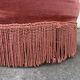 Fauteuil crapaud rose capitonné