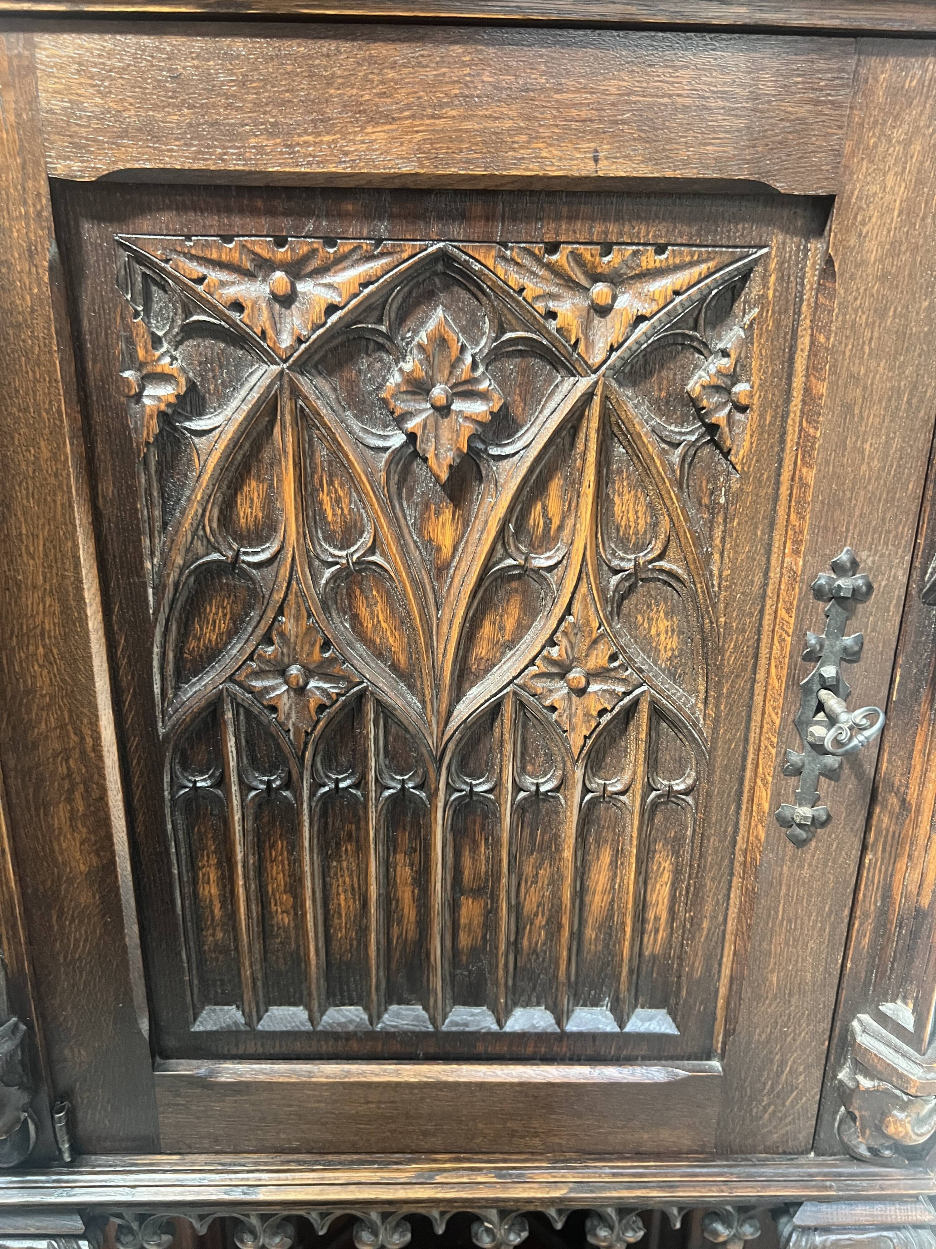 Gothic-style corner cabinet in solid oak, 20th century.
