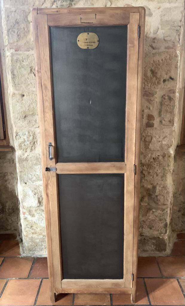 Vintage wooden wardrobe with matte cast iron color hanging rail