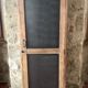 Vintage wooden wardrobe with matte cast iron color hanging rail