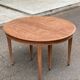 Renovated round extendable dining table made of solid mahogany from the 19th century.