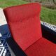 Vintage armchairs in red and black faux leather, the pair.