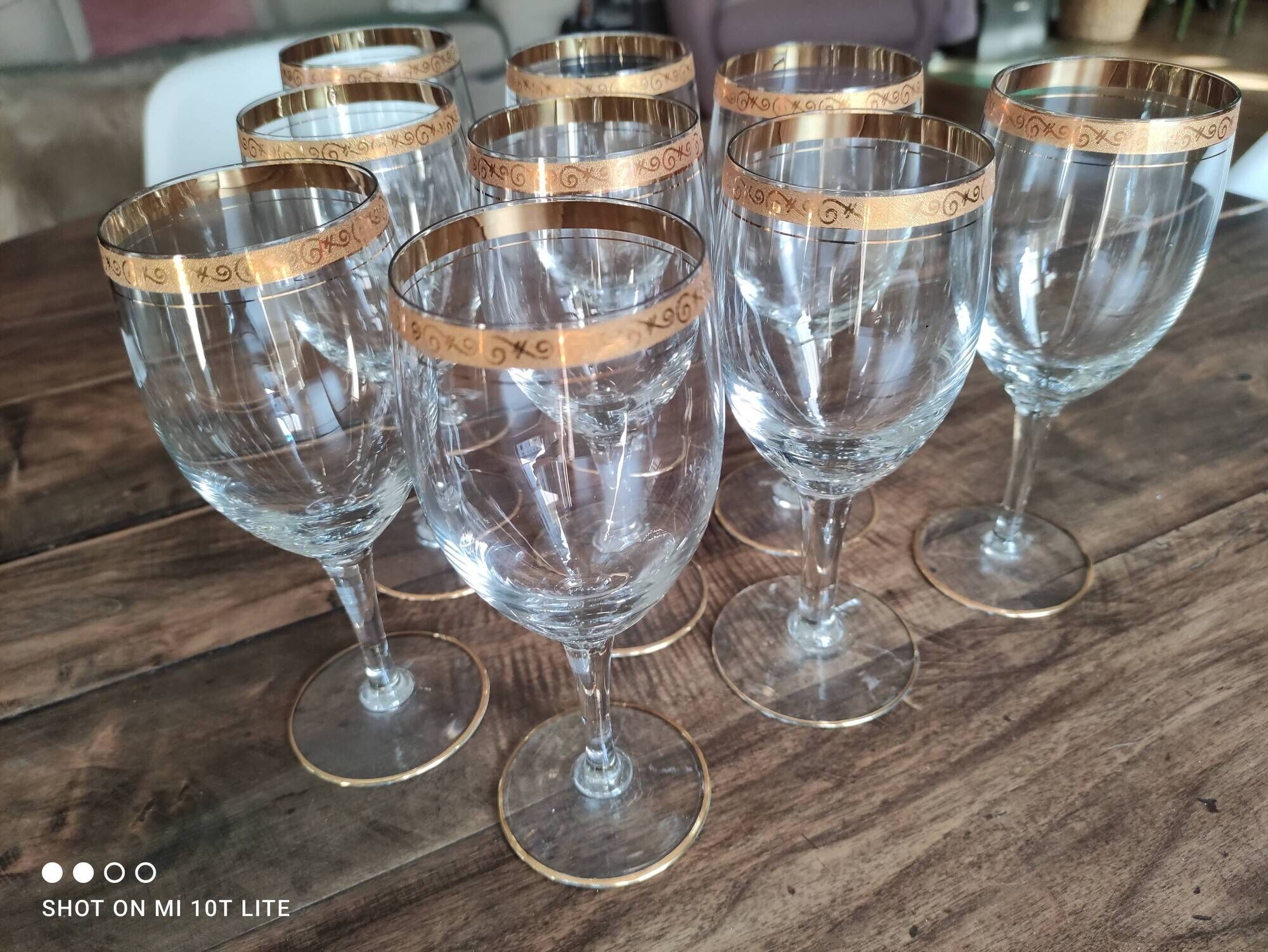 Set of 9 water or red wine glasses in crystal curled and gilded edging