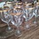 Set of 9 water or red wine glasses in crystal curled and gilded edging