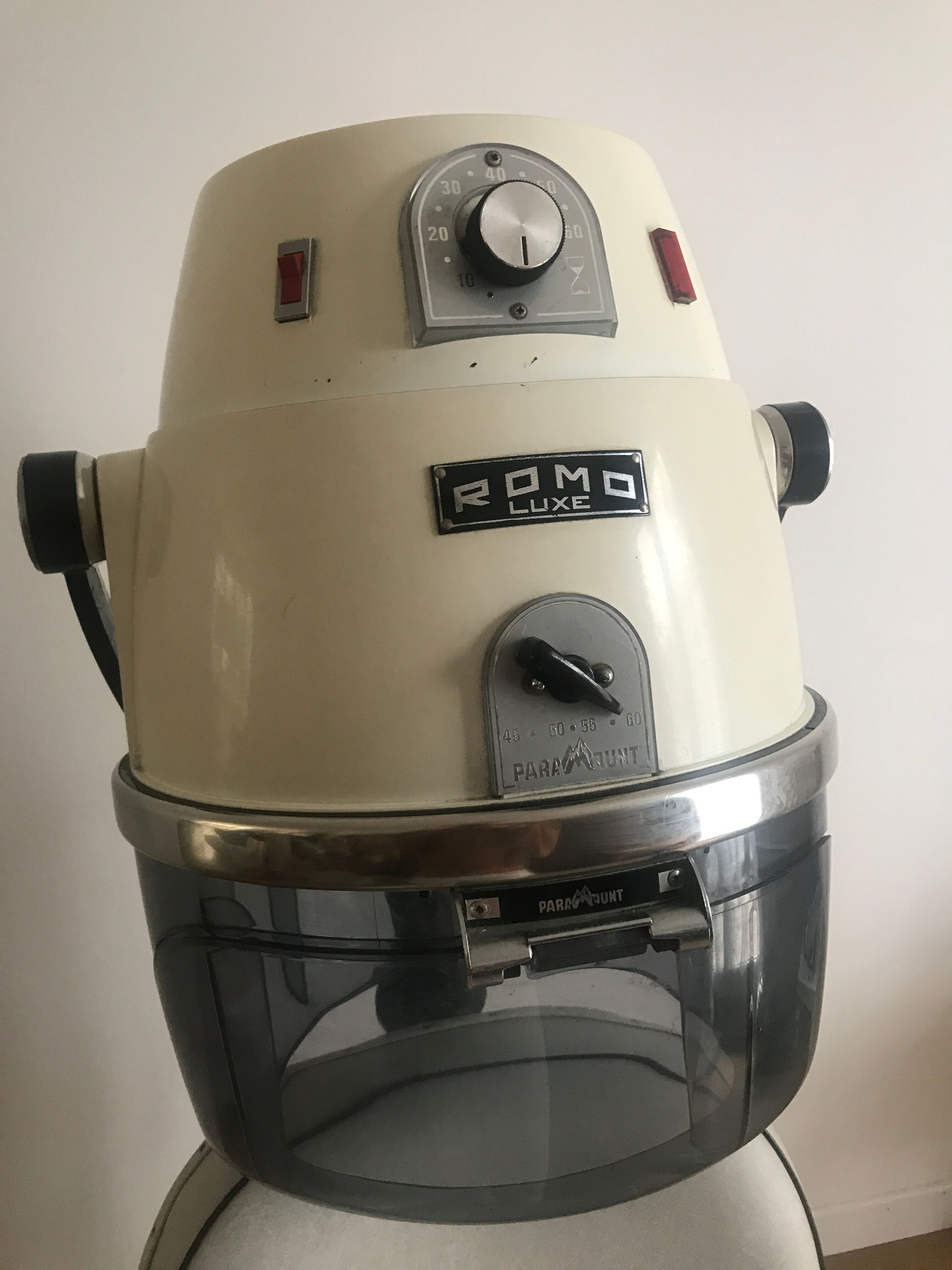 Vintage hairdresser's armchair with helmet transformed into a lamp