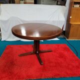 Baumann style round table with integrated extensions from the 70s