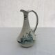 Old pitcher in Dutch-made earthenware signed