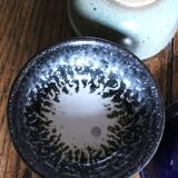 A set of 4 pottery bowls in coloured glaze.