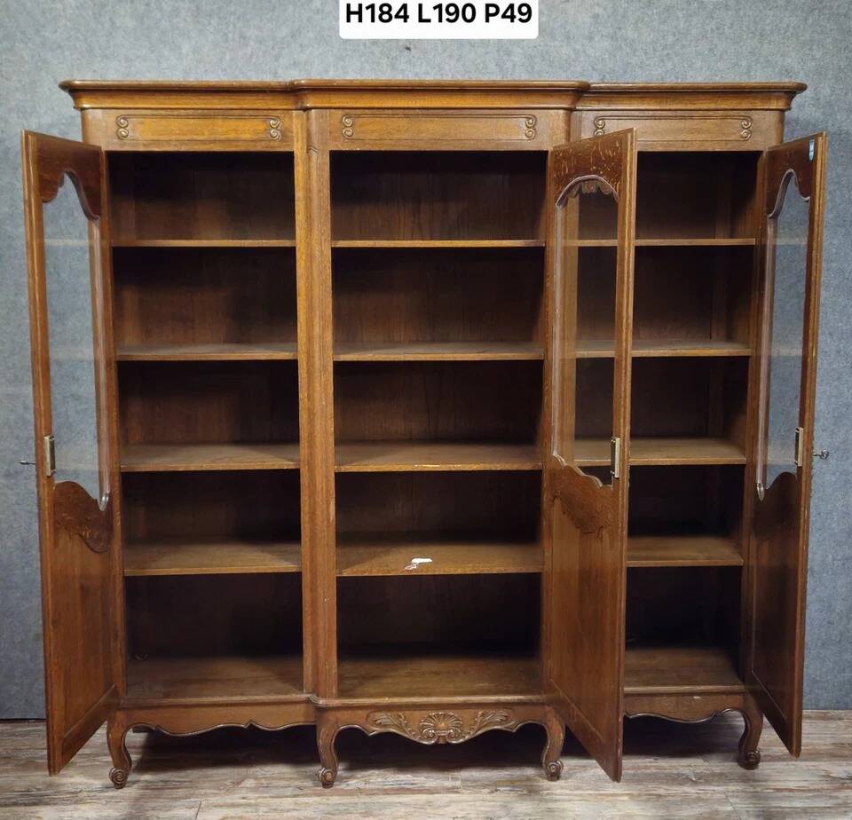 Large Provençal library in Louis XV style made of oak from the 20th century.