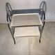 Vintage folding dessert table in chrome metal with enamelled trays.