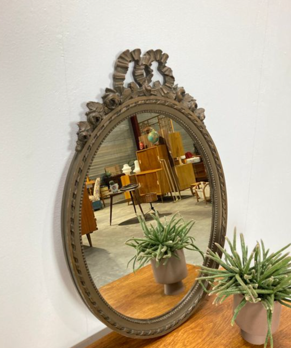 Vintage wooden mirror with arch and flowers