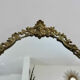 Oval mirror in gilded brass with frieze 40s 50s, 37x50 cm