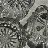 Circular glass ashtray with stylized petal patterns