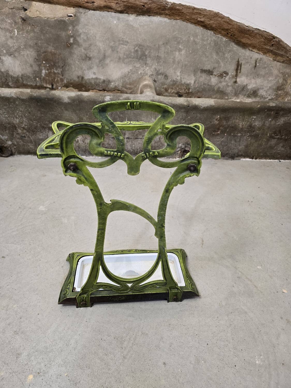 Art Nouveau umbrella stand in green enamelled cast iron