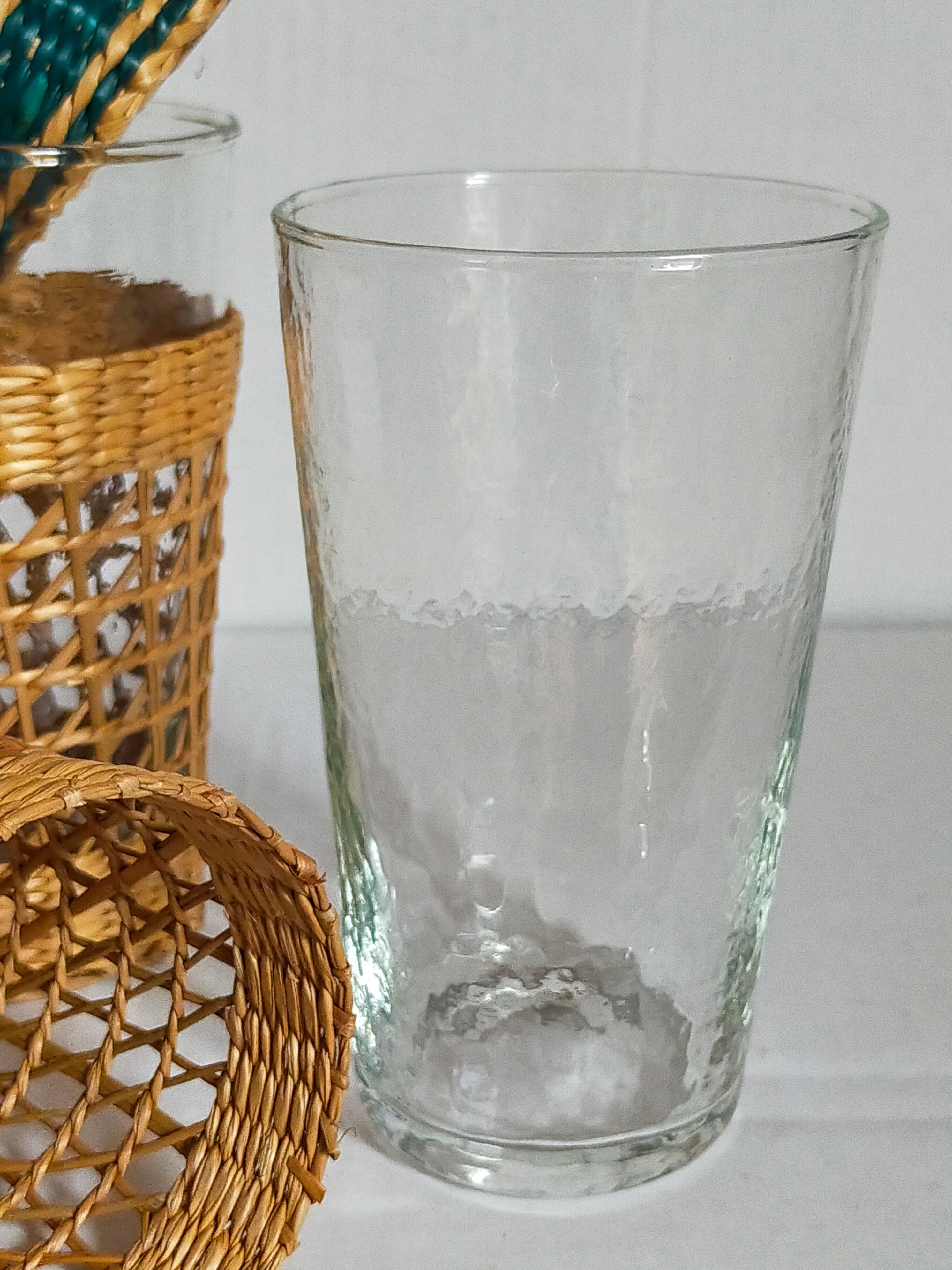 Four long drink glasses in vintage woven rattan cases