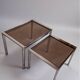 Vintage nesting tables from the 1970s, chrome and smoked glass, mid-century modern.