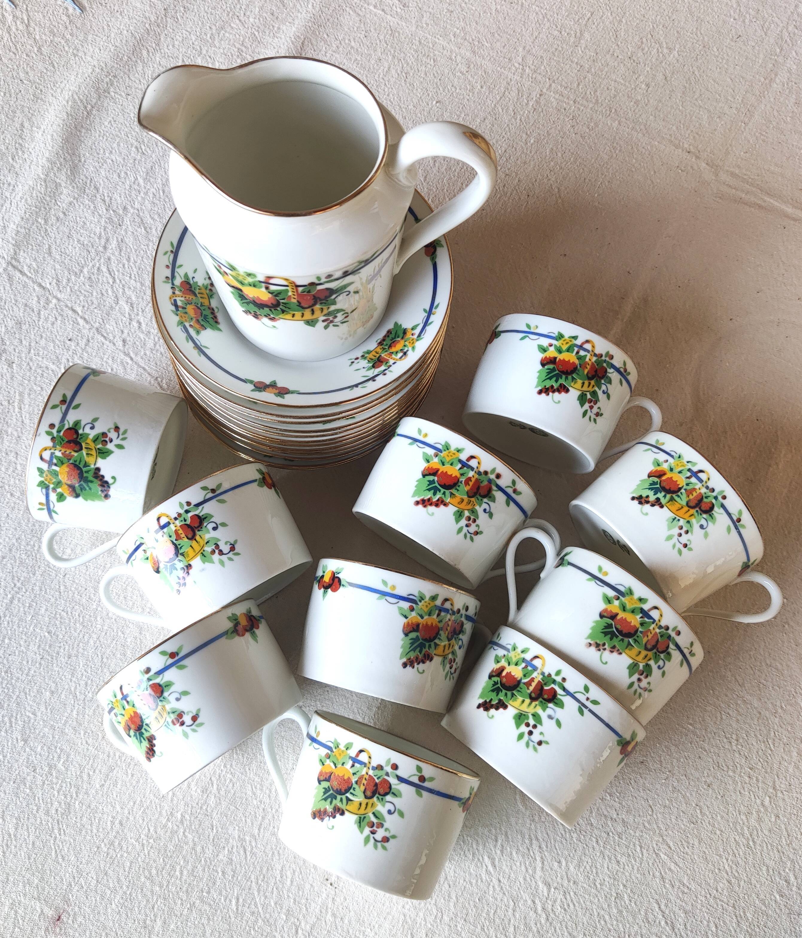 10 tea cups and creamer in Limoges porcelain