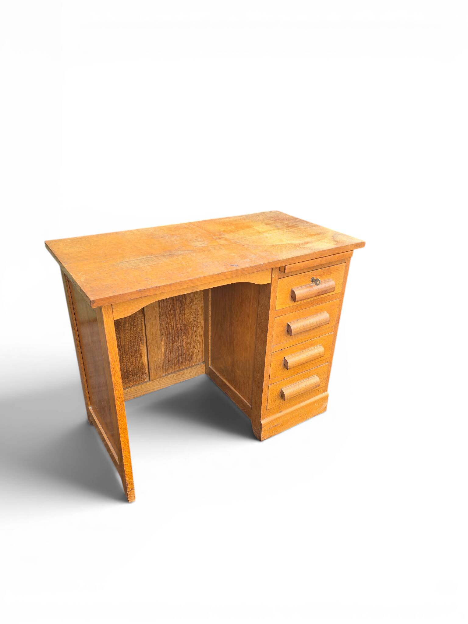 Vintage oak desk with a drawer unit and sliding shelf.