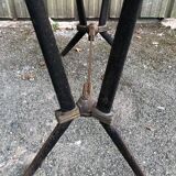 Vintage bistro table with an Art Deco style cast iron base and Formica top.