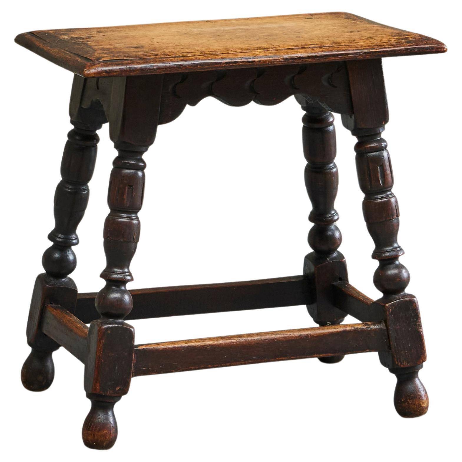 Rustic stool or side table in turned and carved solid oak, 19th century.