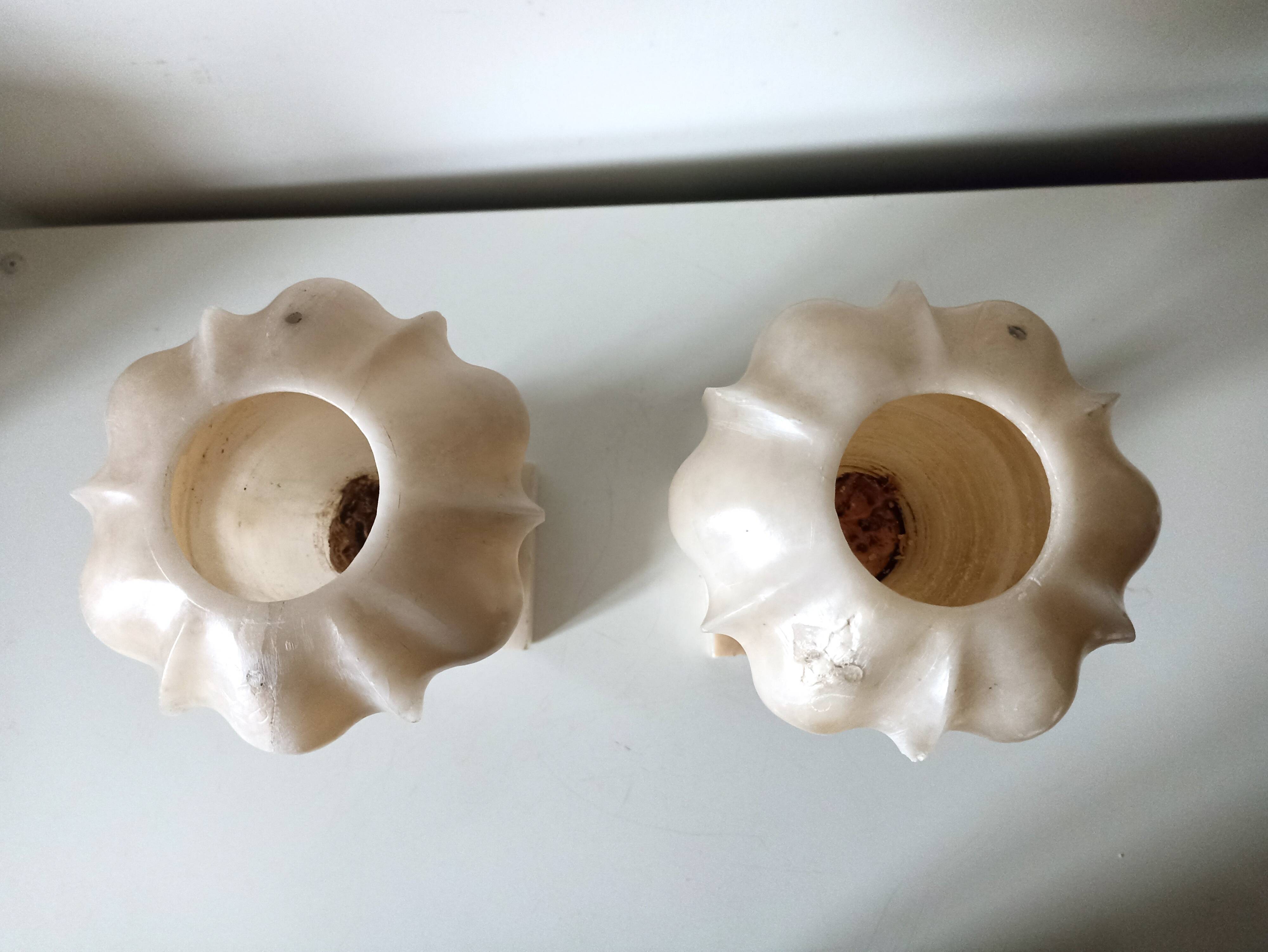 Pair of alabaster fireplace vases on marble base