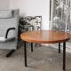 Round coffee table in walnut veneer and metal