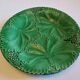 8 green barbotine plates from the early 20th century.