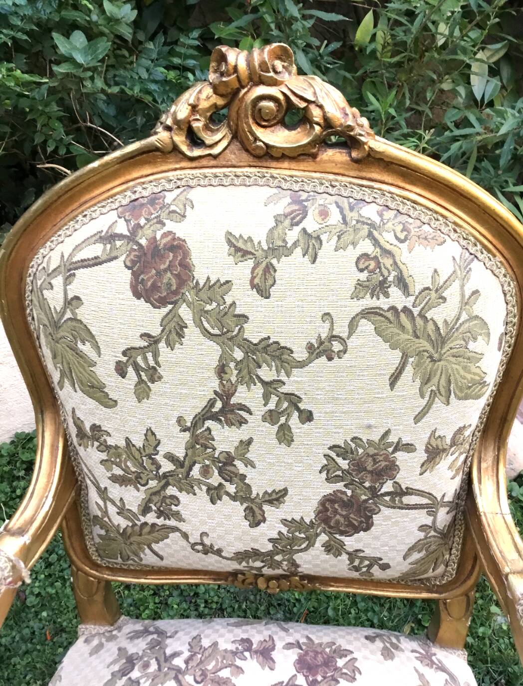 Pair of straight-backed armchairs, known as "queen's armchairs," in carved and gilded wood
