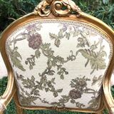 Pair of straight-backed armchairs, known as "queen's armchairs," in carved and gilded wood