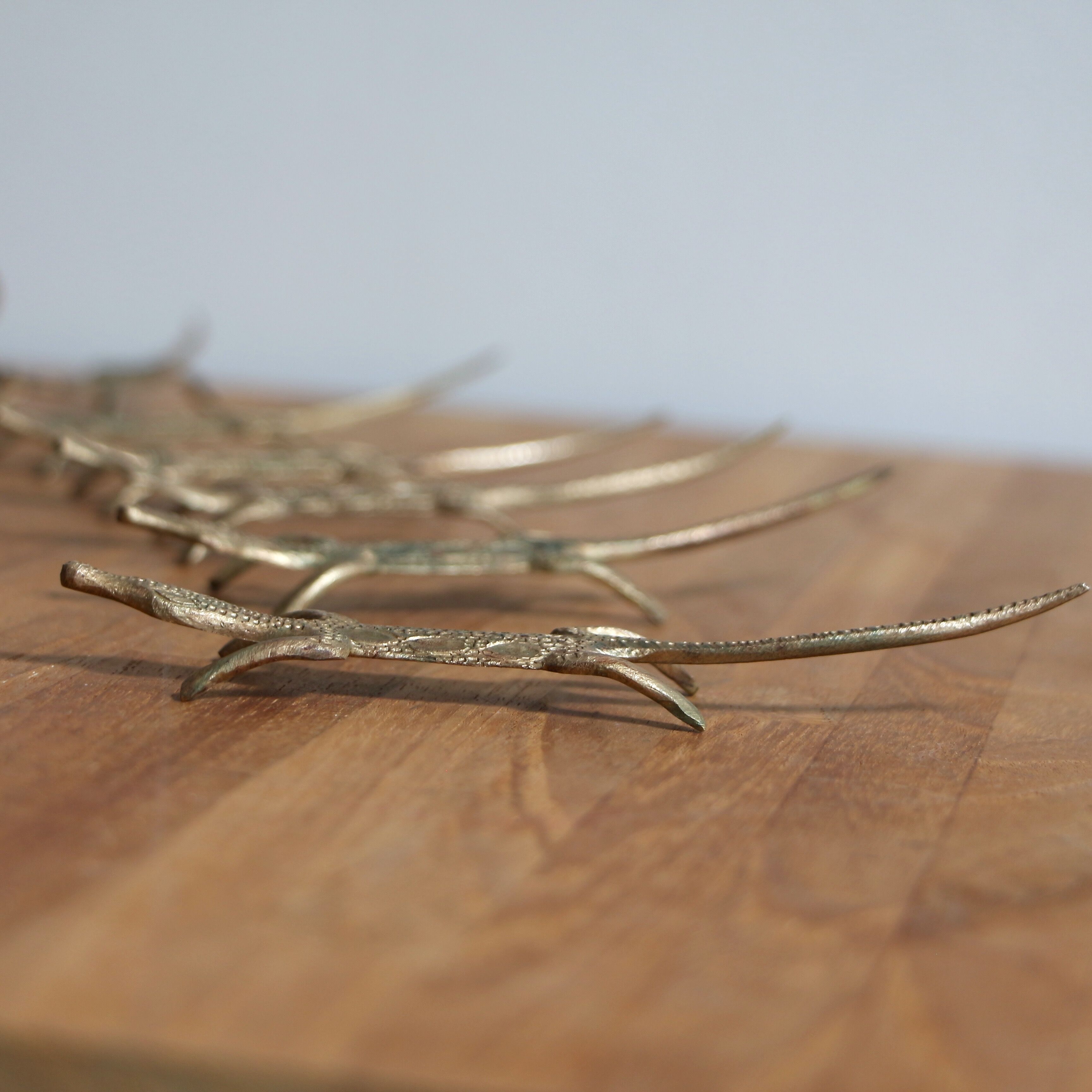 Brass crocodile knife holder