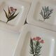 Set of three square plates from Deruta signed MARI E.C., botanical decoration 962.21