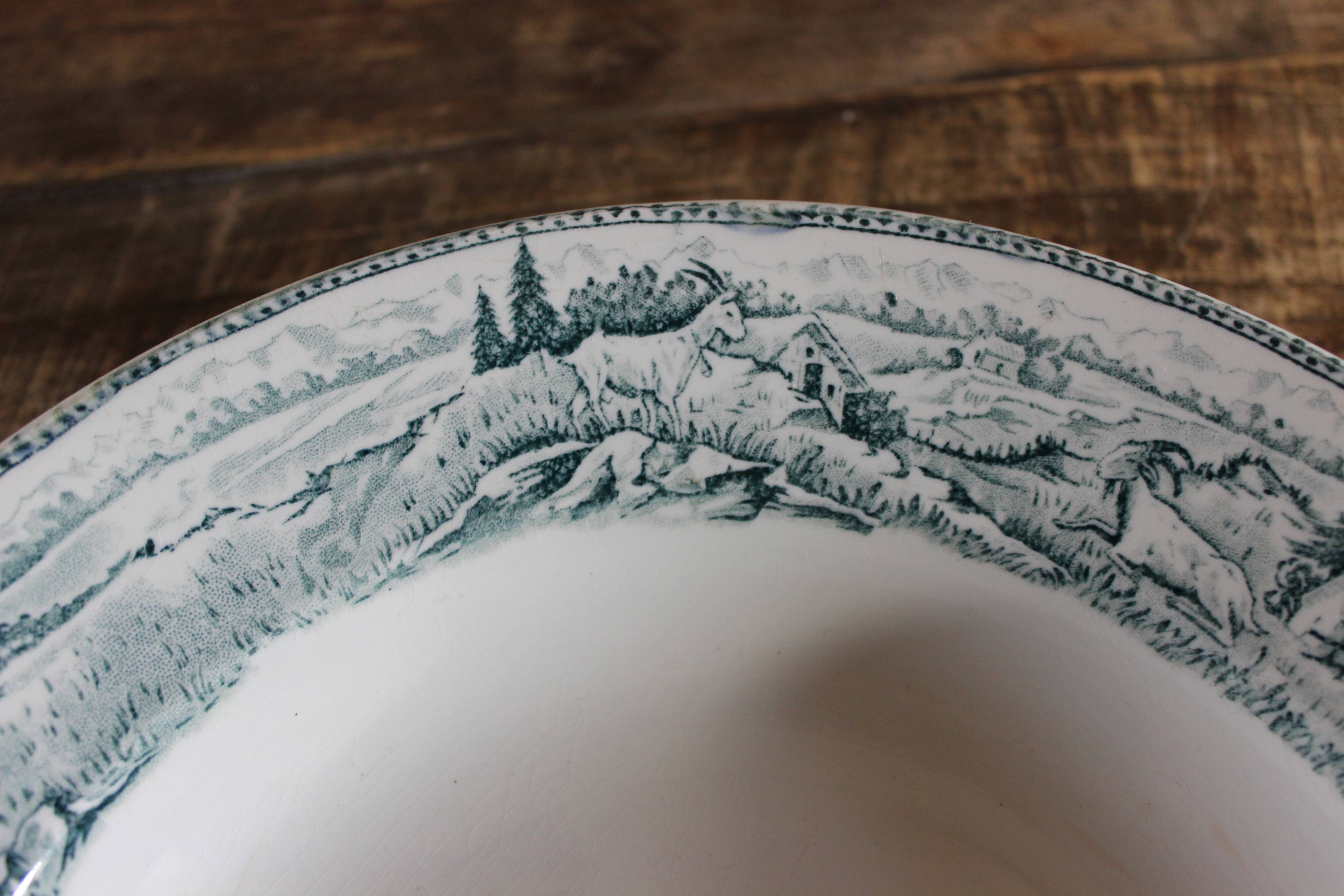 Round hollow dish, Iron earth, Saint Amand, milkmaid model, goat decoration