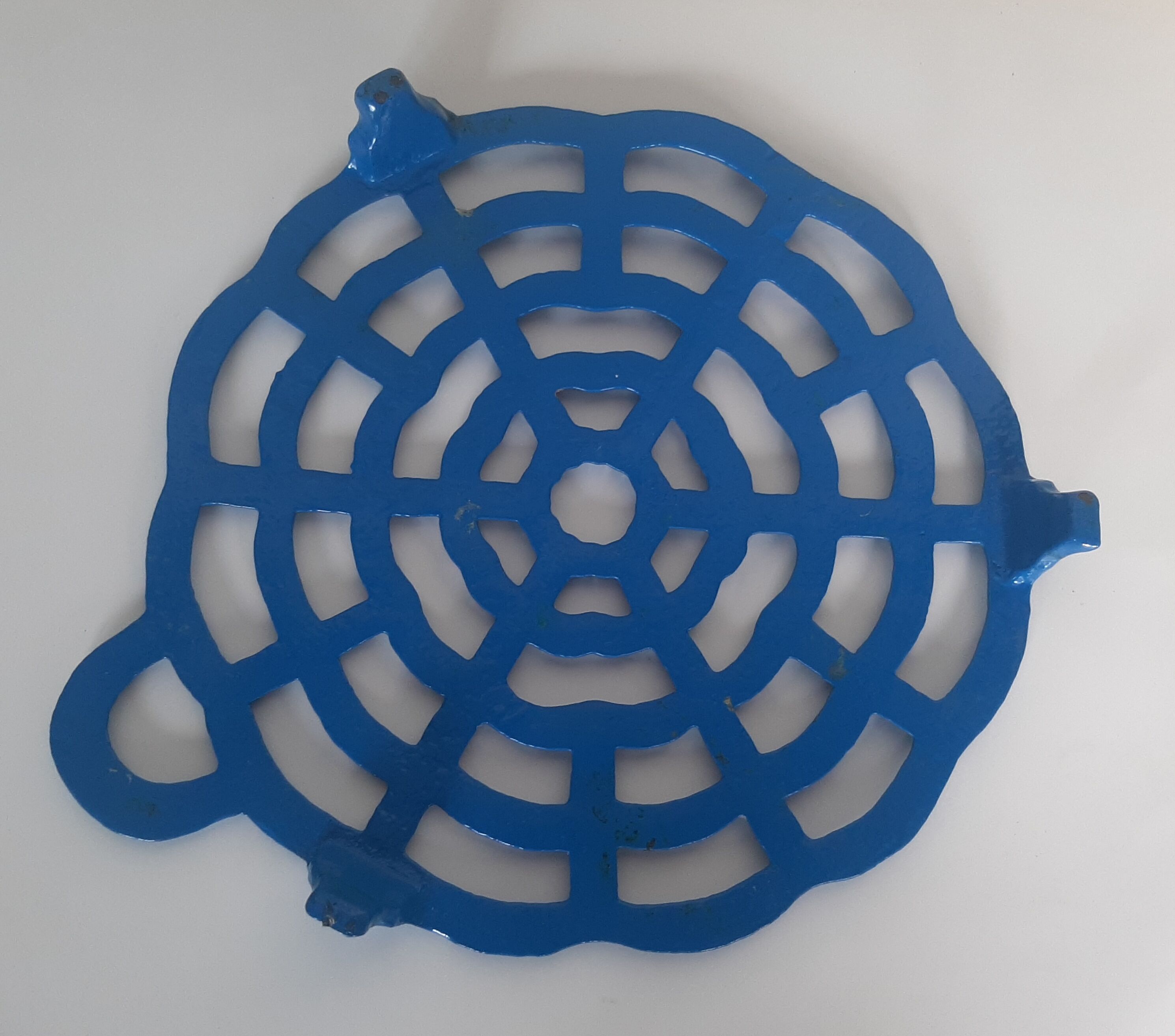 Old blue vintage enamelled table mat