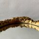 Small vintage oval wall mirror in varnished gold resin