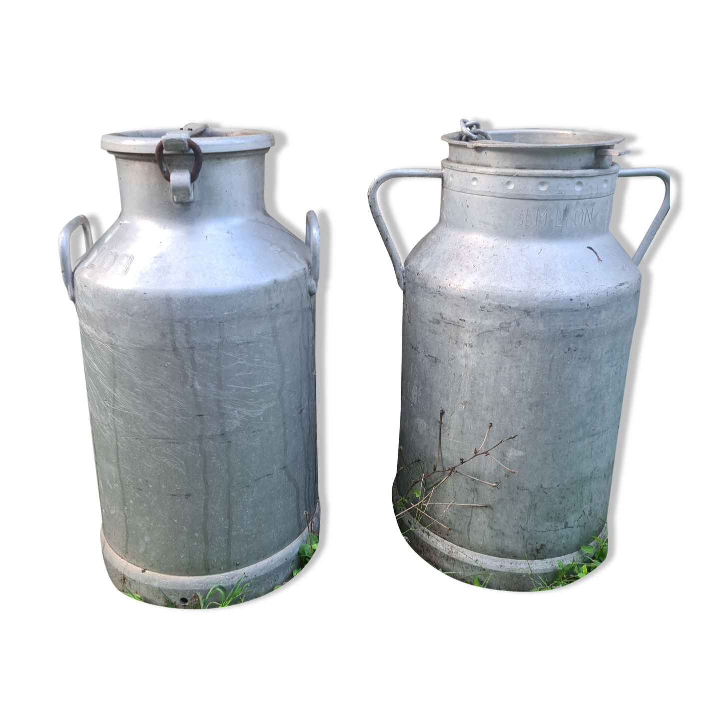 set of 2 old aluminum milk jugs