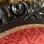 Napoleon III medallion armchair in carved wood and red velvet.