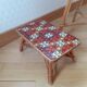 Rattan table and its small bench