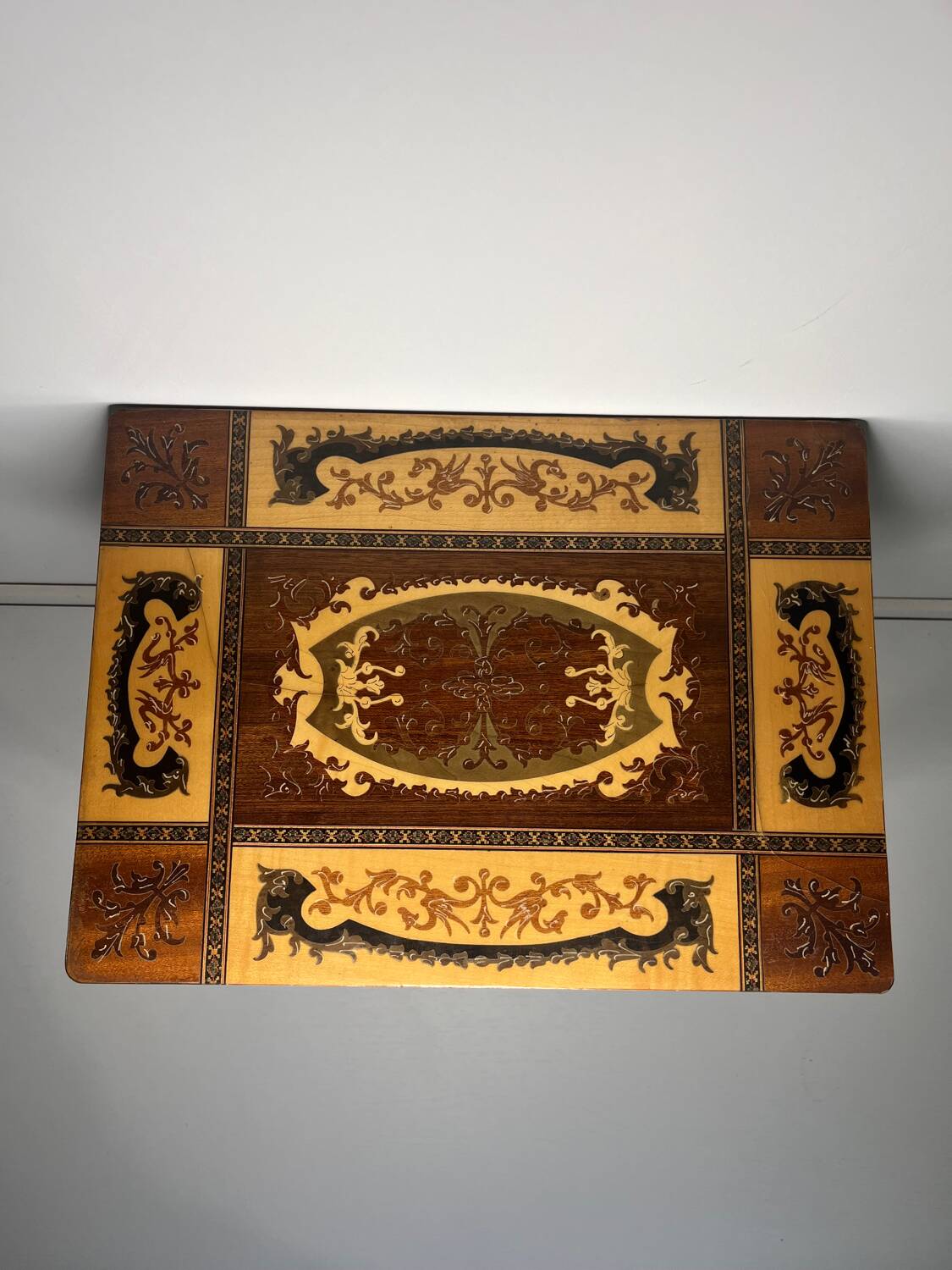 Small antique Italian inlaid table with Swiss music box.