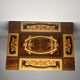 Small antique Italian inlaid table with Swiss music box.
