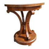 Art Deco side table in brown walnut, round top and scroll legs, France 1930s.