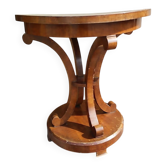 Art Deco side table in brown walnut, round top and scroll legs, France 1930s.