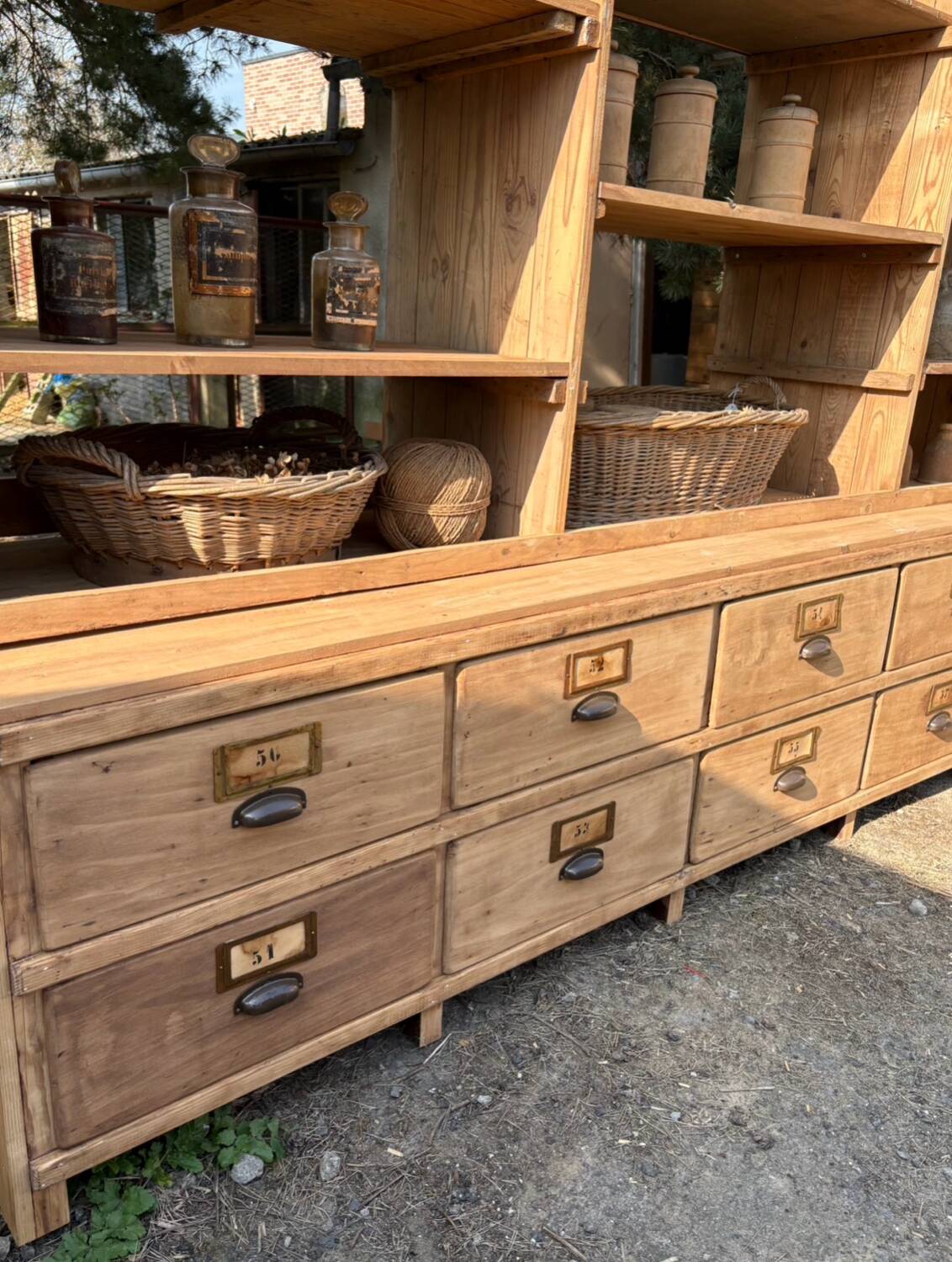 Large antique workshop furniture with drawers and shelves.