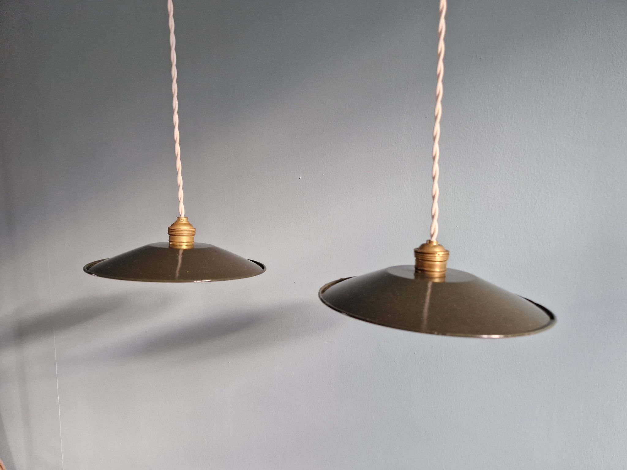 Pair of industrial pendant lights in olive green enameled sheet metal